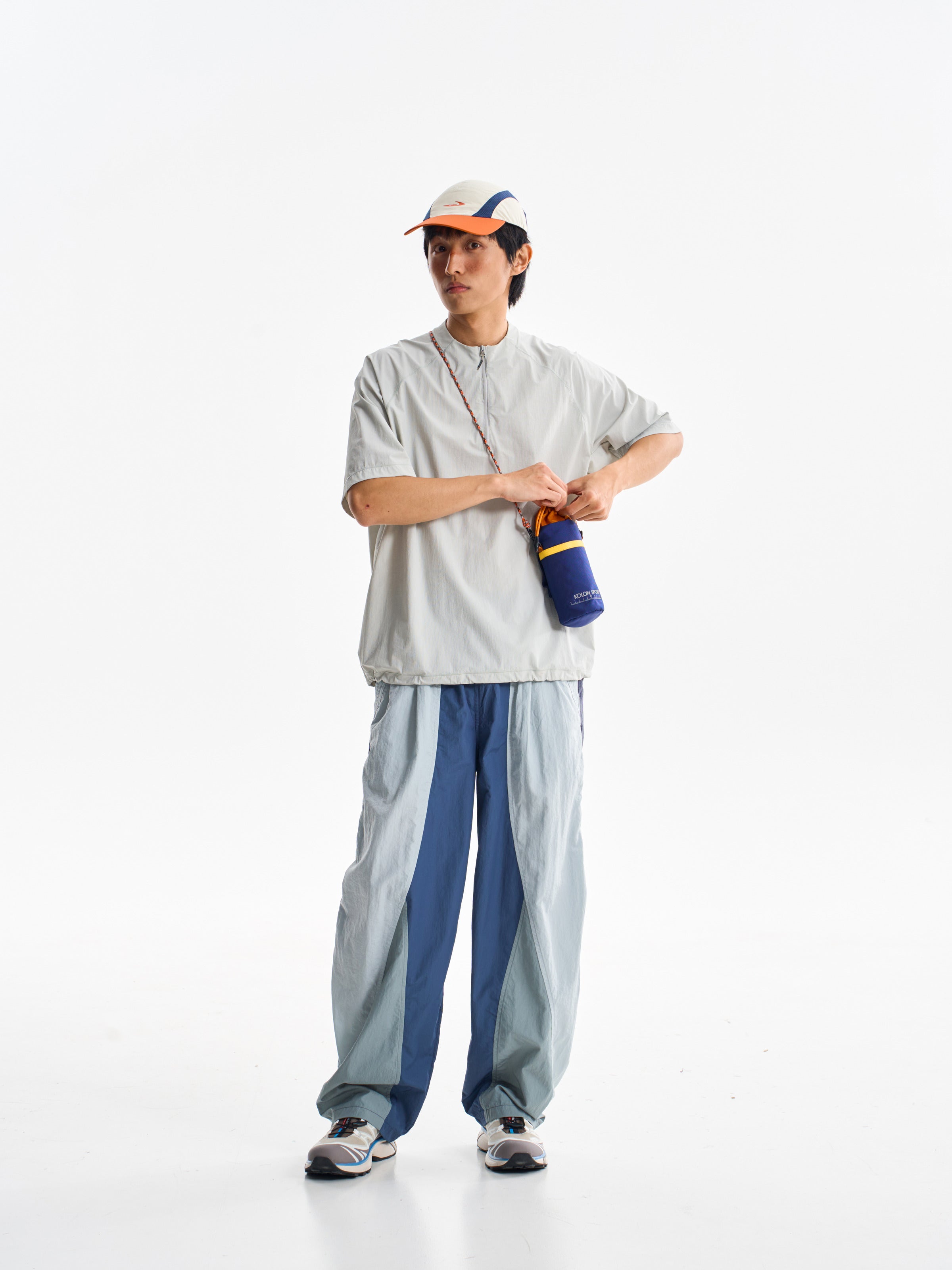 Blue hiking pants — front view showing the deep blue centre and pale blue sides
