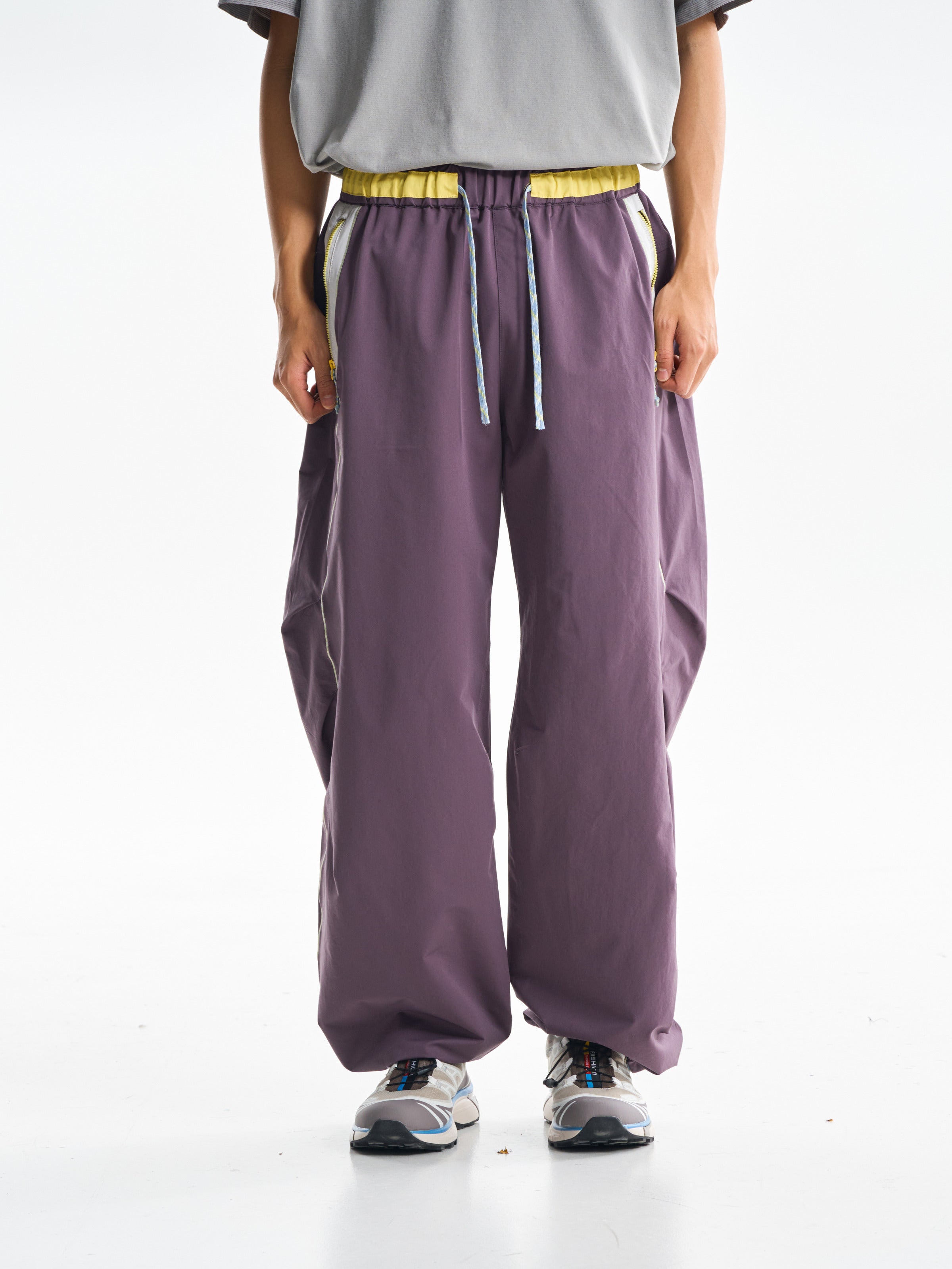 Deep Purple hiking pants — front view showing the curved legs and gathered hems