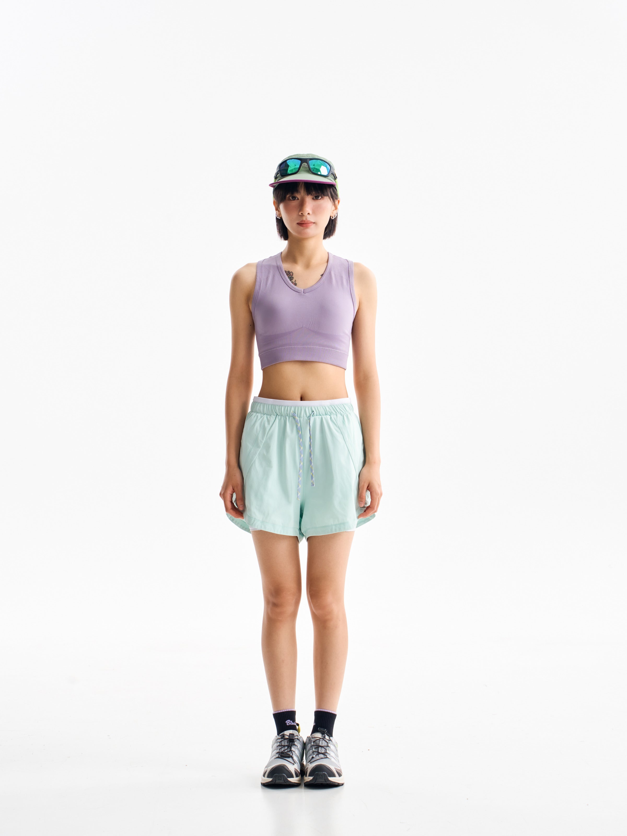 Green hiking shorts — front view showing the drawcord waist and relaxed leg shape