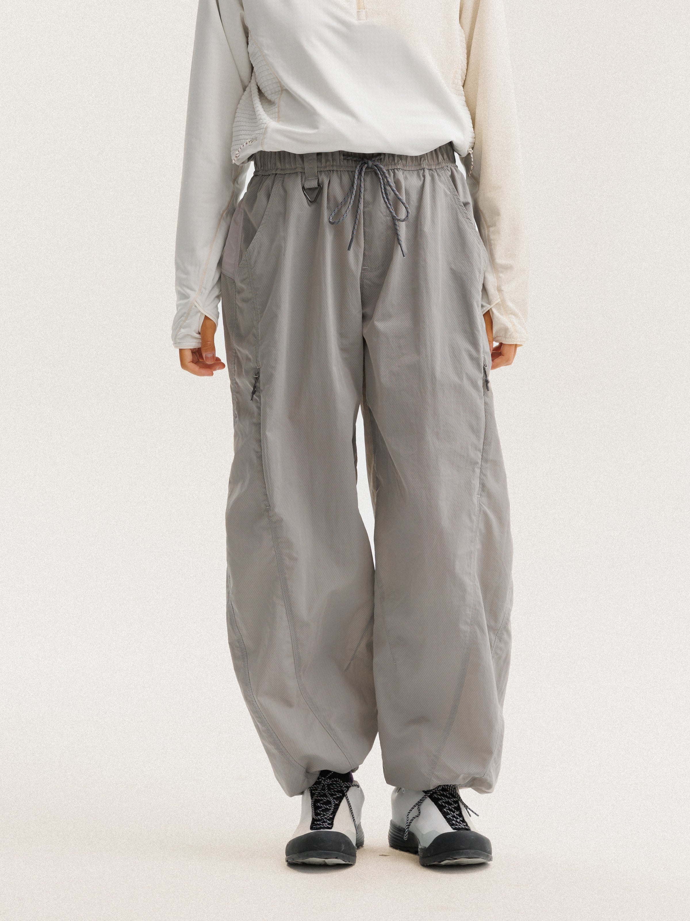 Light Gray hiking pants — front view with the drawcord waist and gathered hems visible