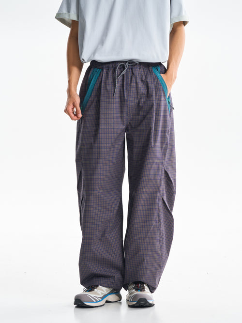 Slate Purple hiking cargo pants — front view showing the curved legs and checked fabric