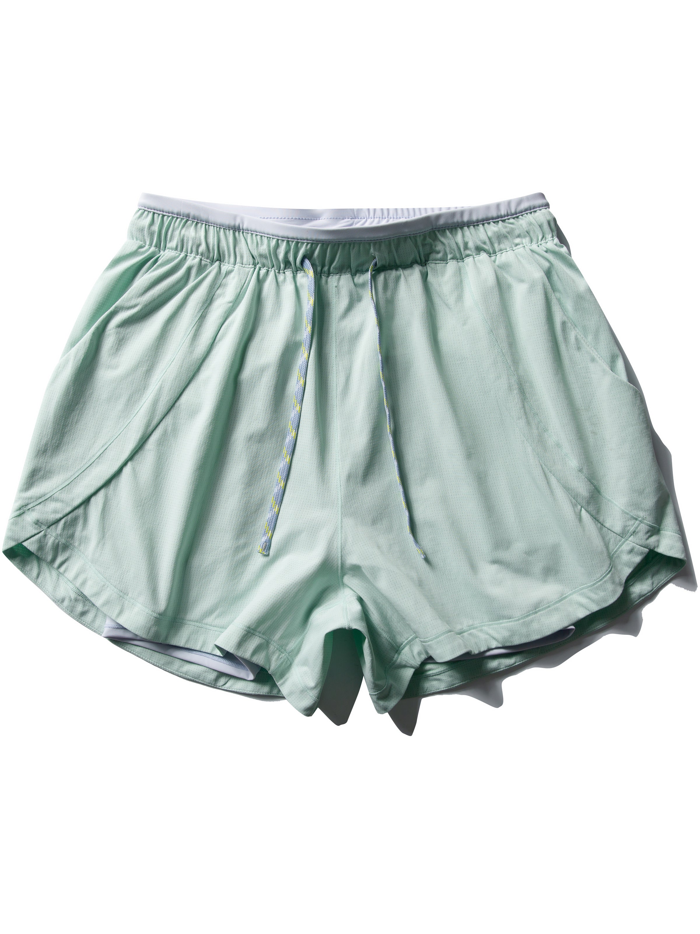 Green hiking shorts — flat front view showing the waistband and layered leg openings