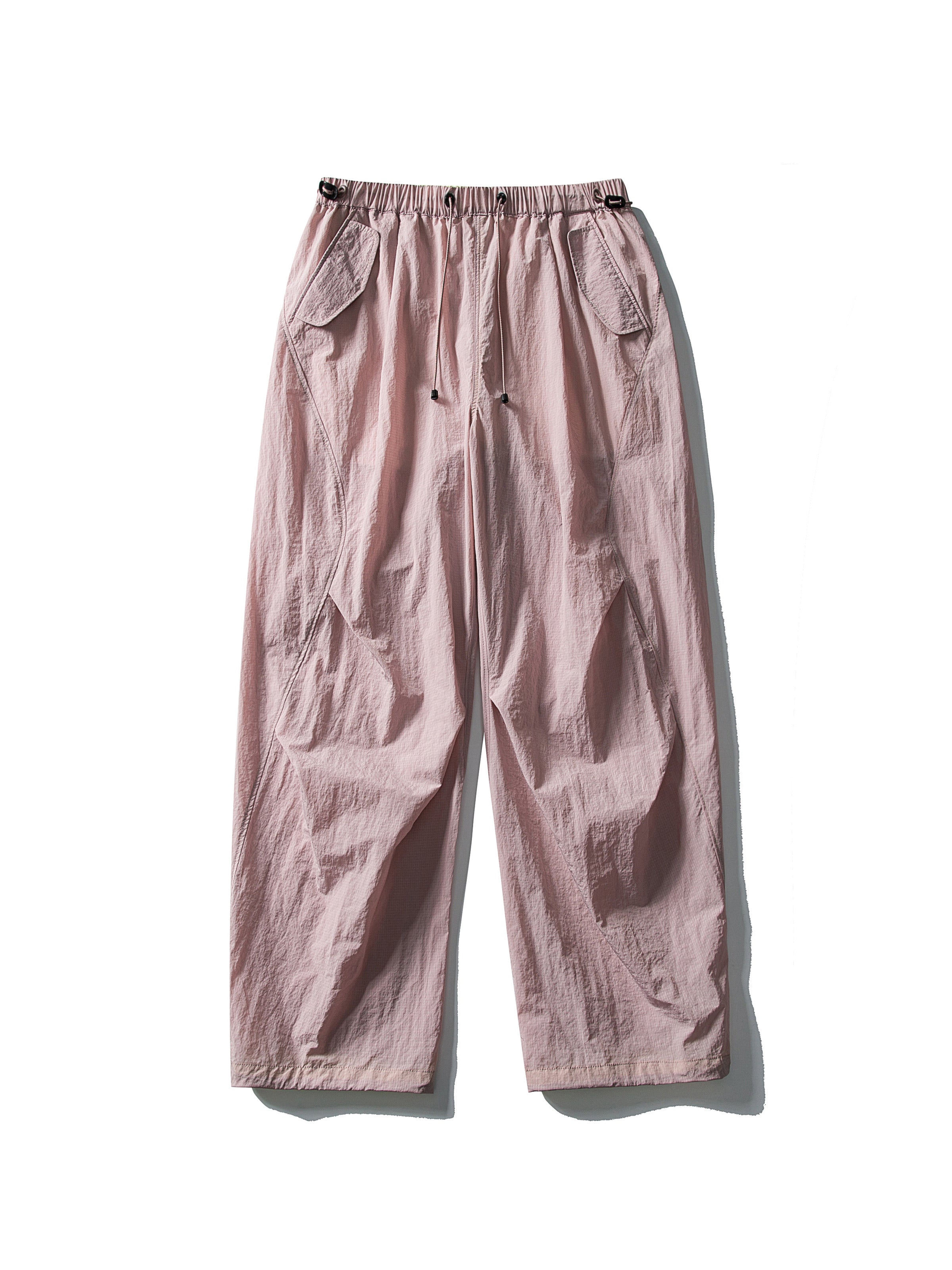 Pink hiking pants — flat front view showing the waist cords and open hems