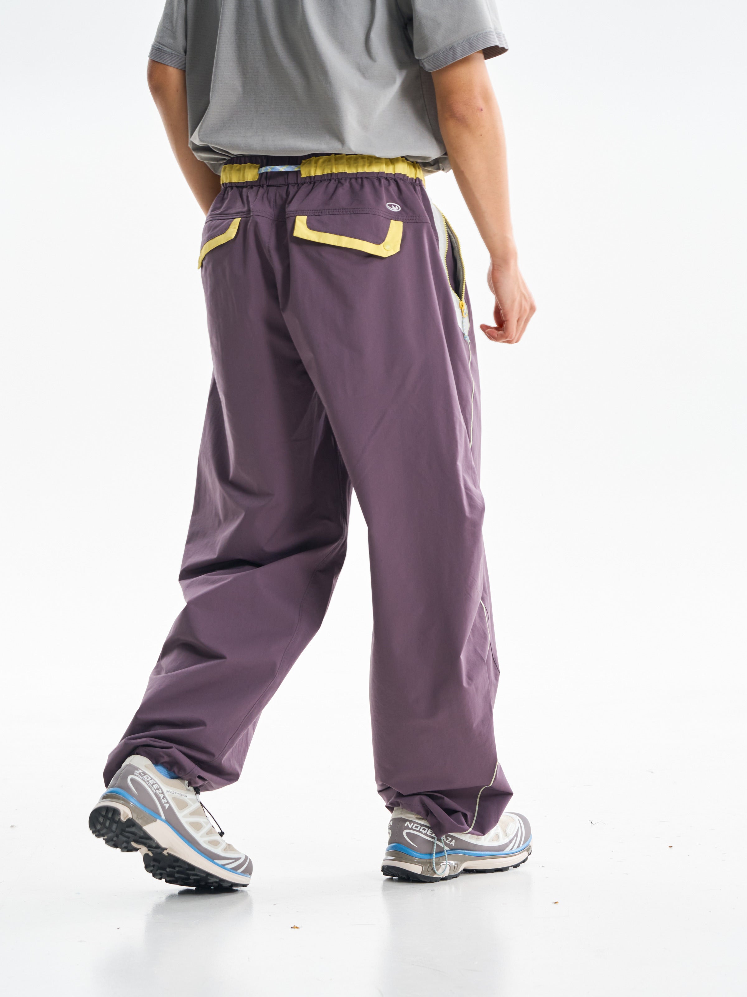 Deep Purple hiking pants — rear three-quarter view showing both back pockets