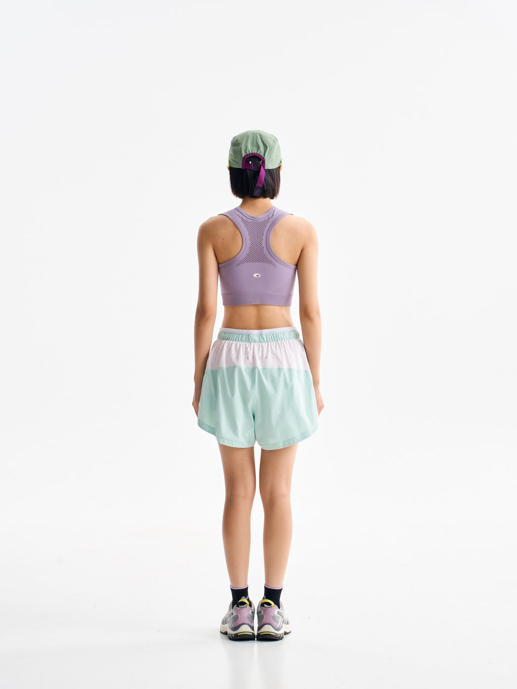 Green hiking shorts — back view showing the pale rear waistband panel
