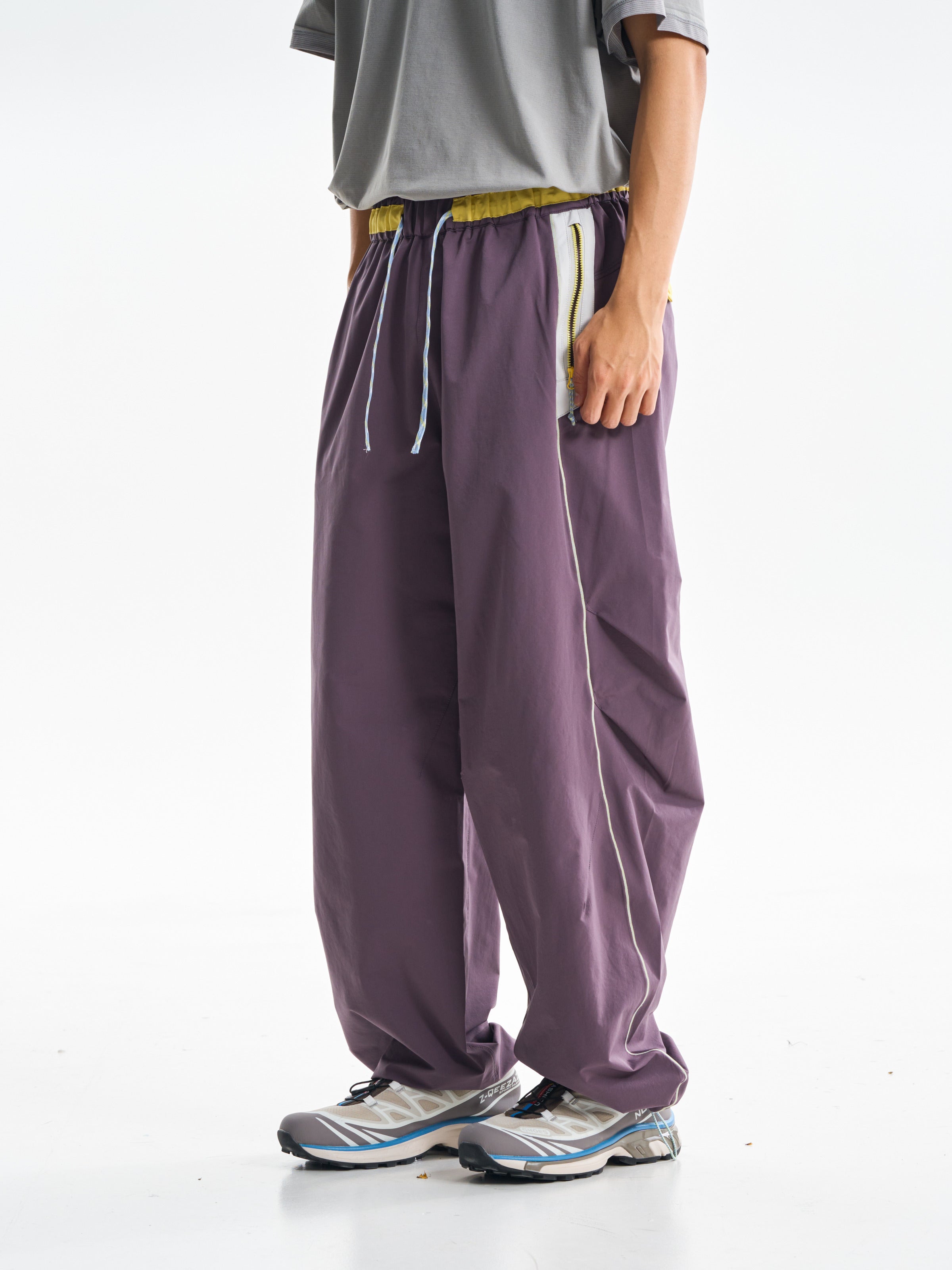 Deep Purple hiking pants — side view showing the curved seam and relaxed leg shape