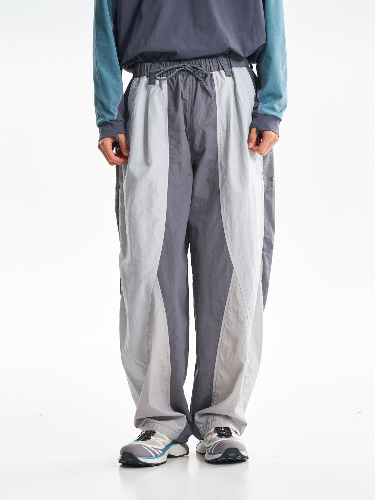 Gray hiking pants — front view showing the dark centre and light outer leg panels