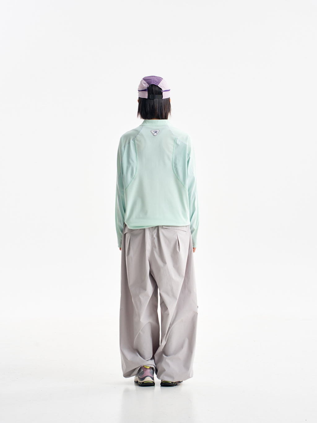 Light Gray hiking pants — rear view with the upper waistband covered by a mint jacket