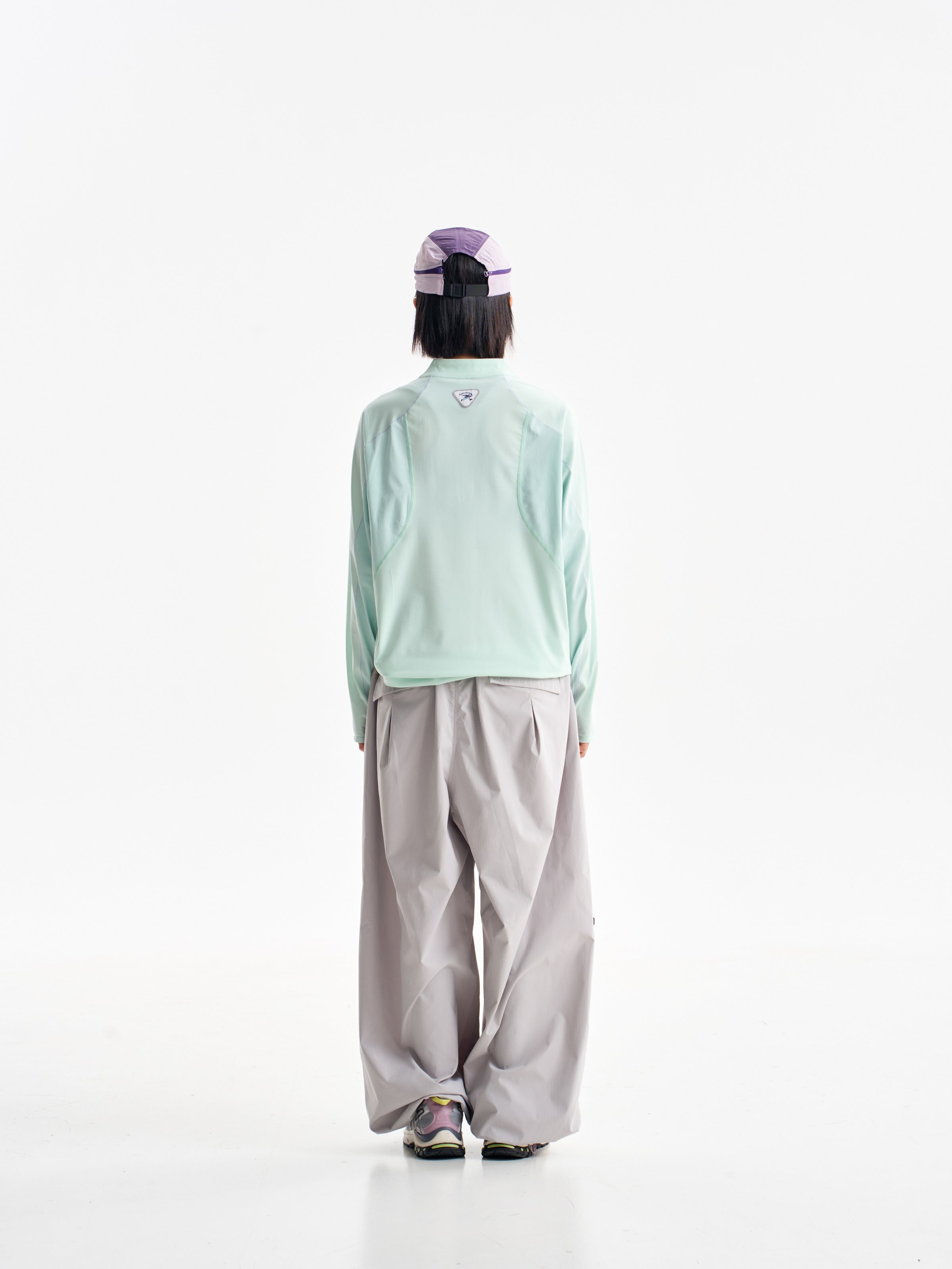 Light Gray hiking pants — rear view with the upper waistband covered by a mint jacket