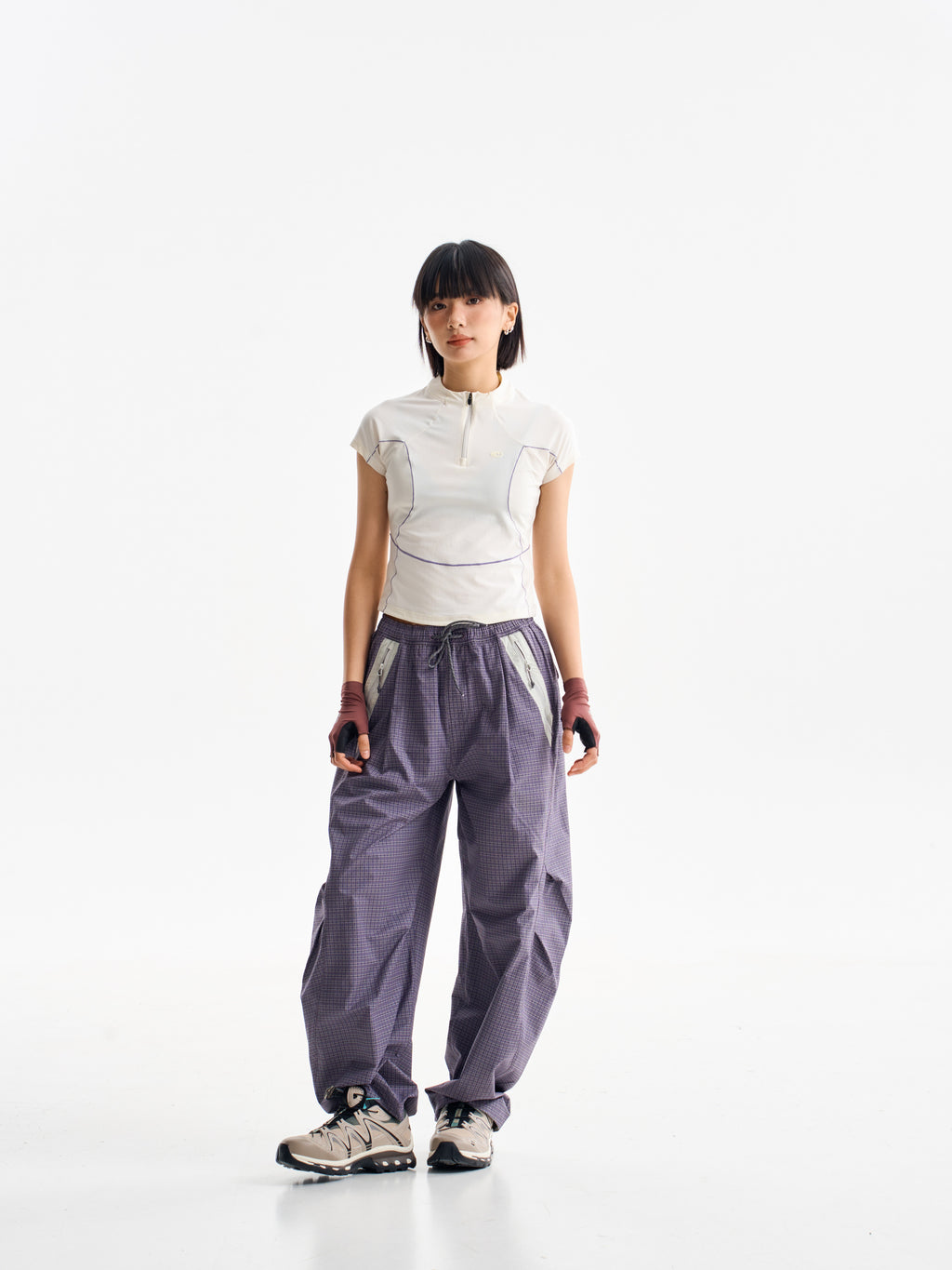 Cardamom Purple hiking cargo pants — front view showing the curved legs and checked fabric