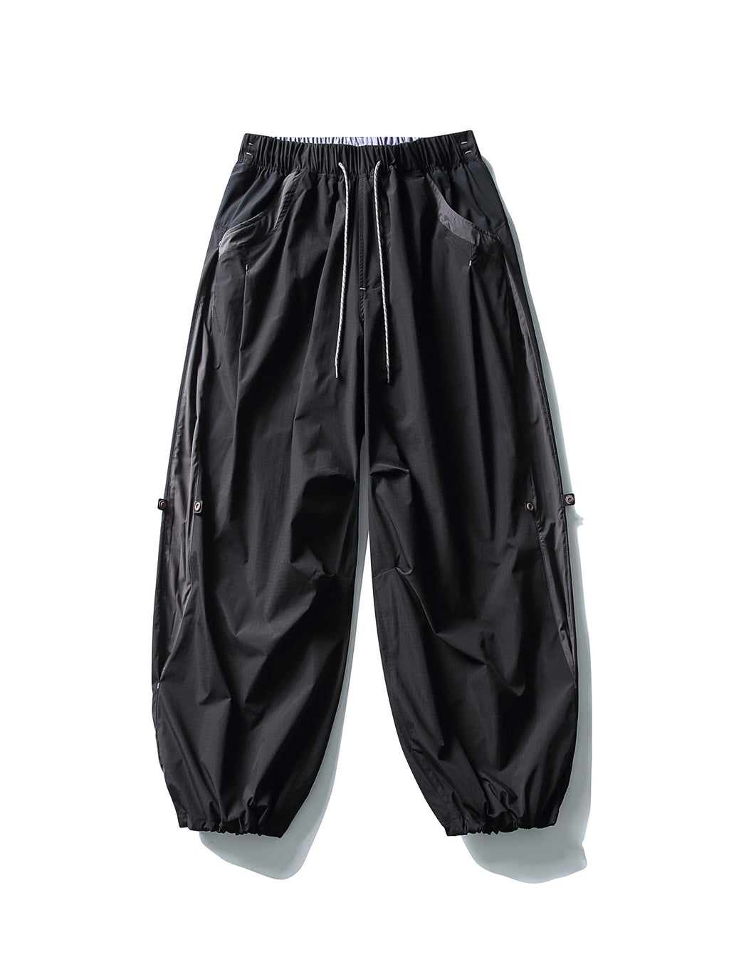 Black hiking pants — flat front view with both hems gathered
