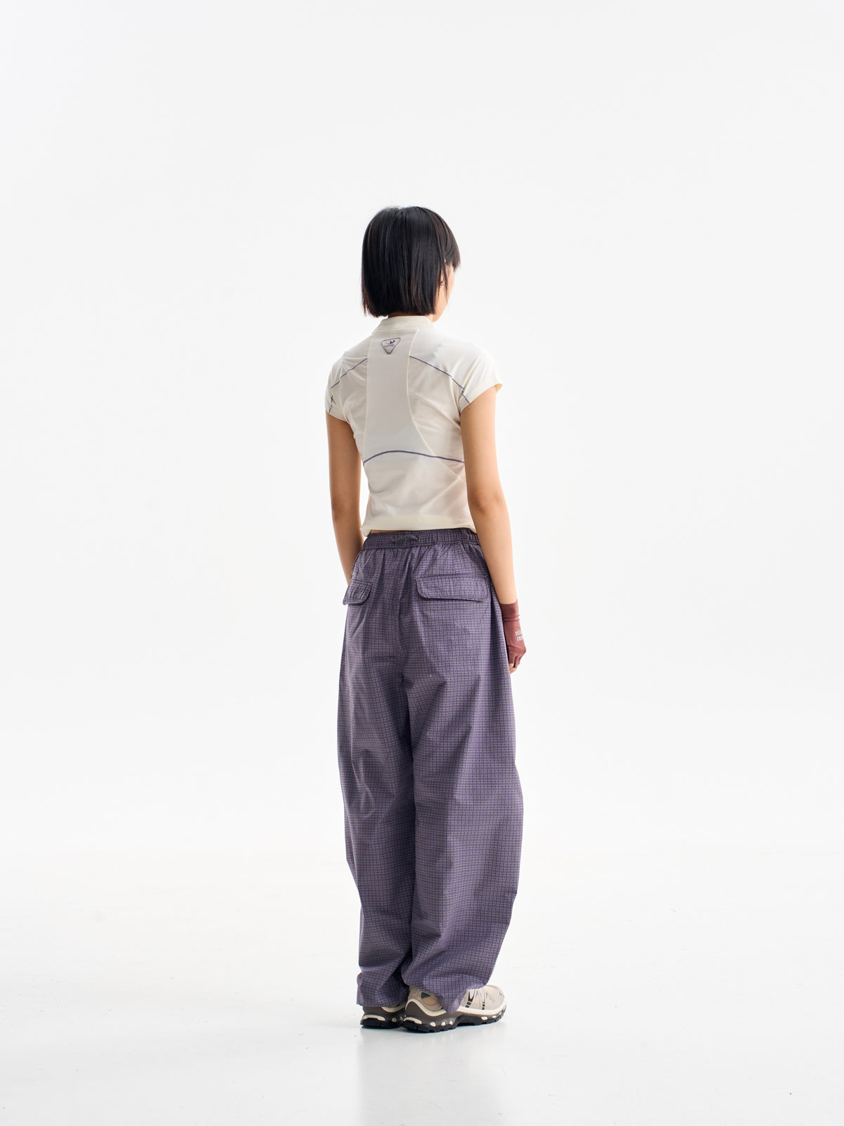 Cardamom Purple hiking cargo pants — rear view showing the back pockets and leg shape