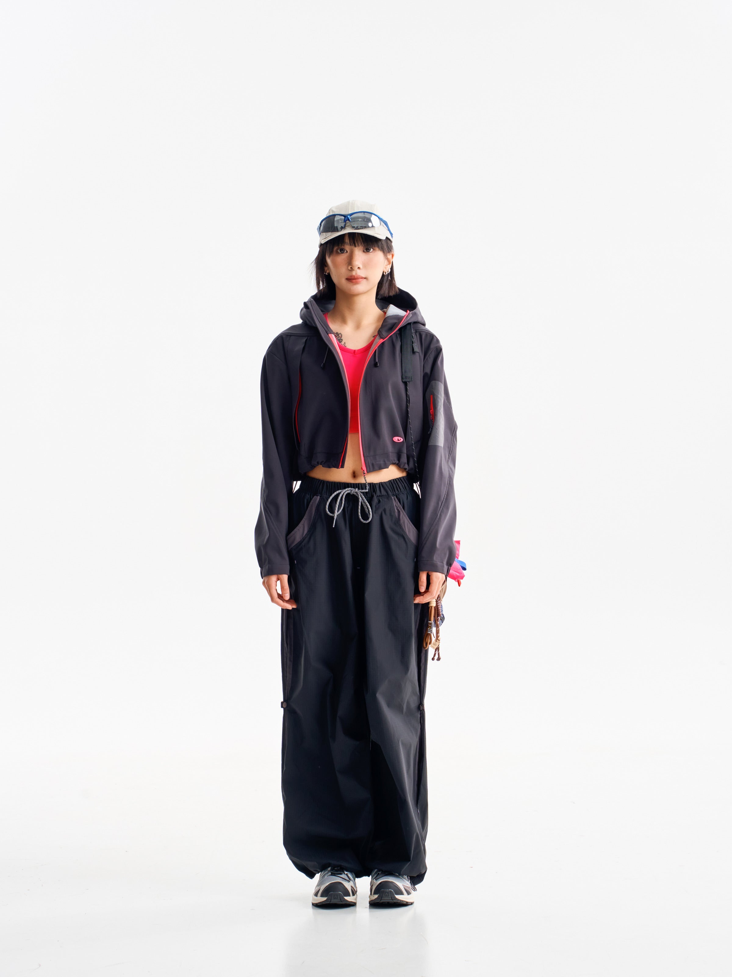 Black hiking pants — front view with a dark jacket and gathered hems