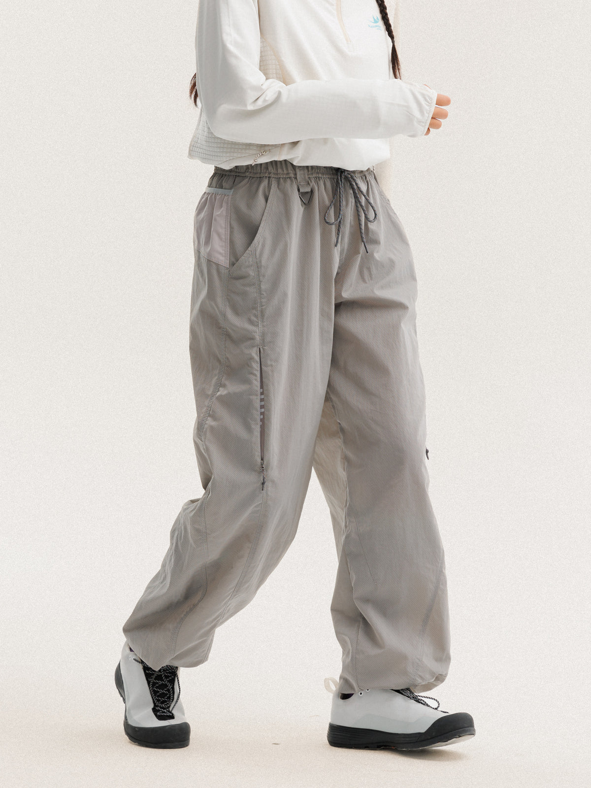 Light Gray hiking pants — walking view showing the loose legs and side seams