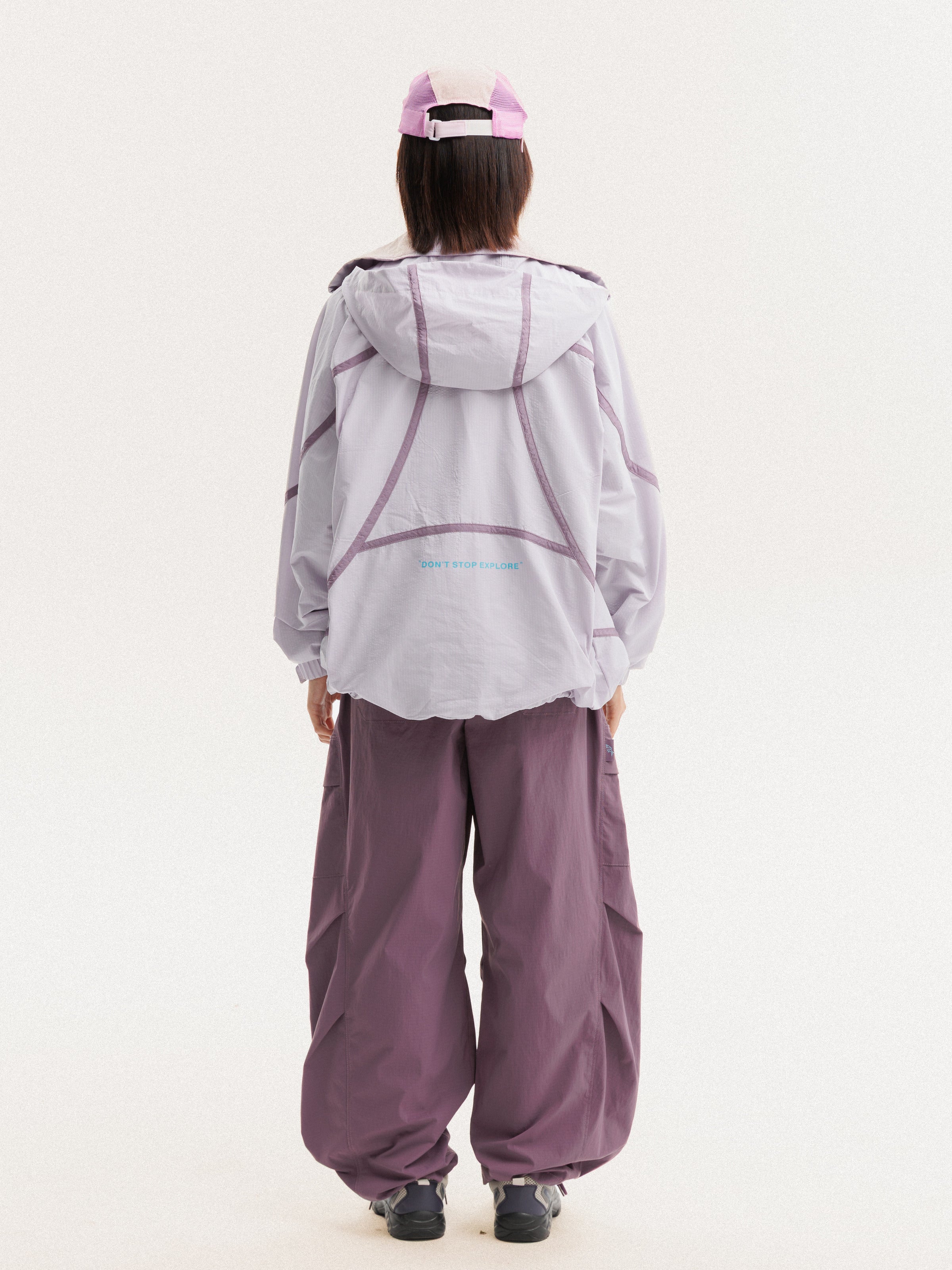 Purple Pink jacket — rear view showing the hood and curved back seams