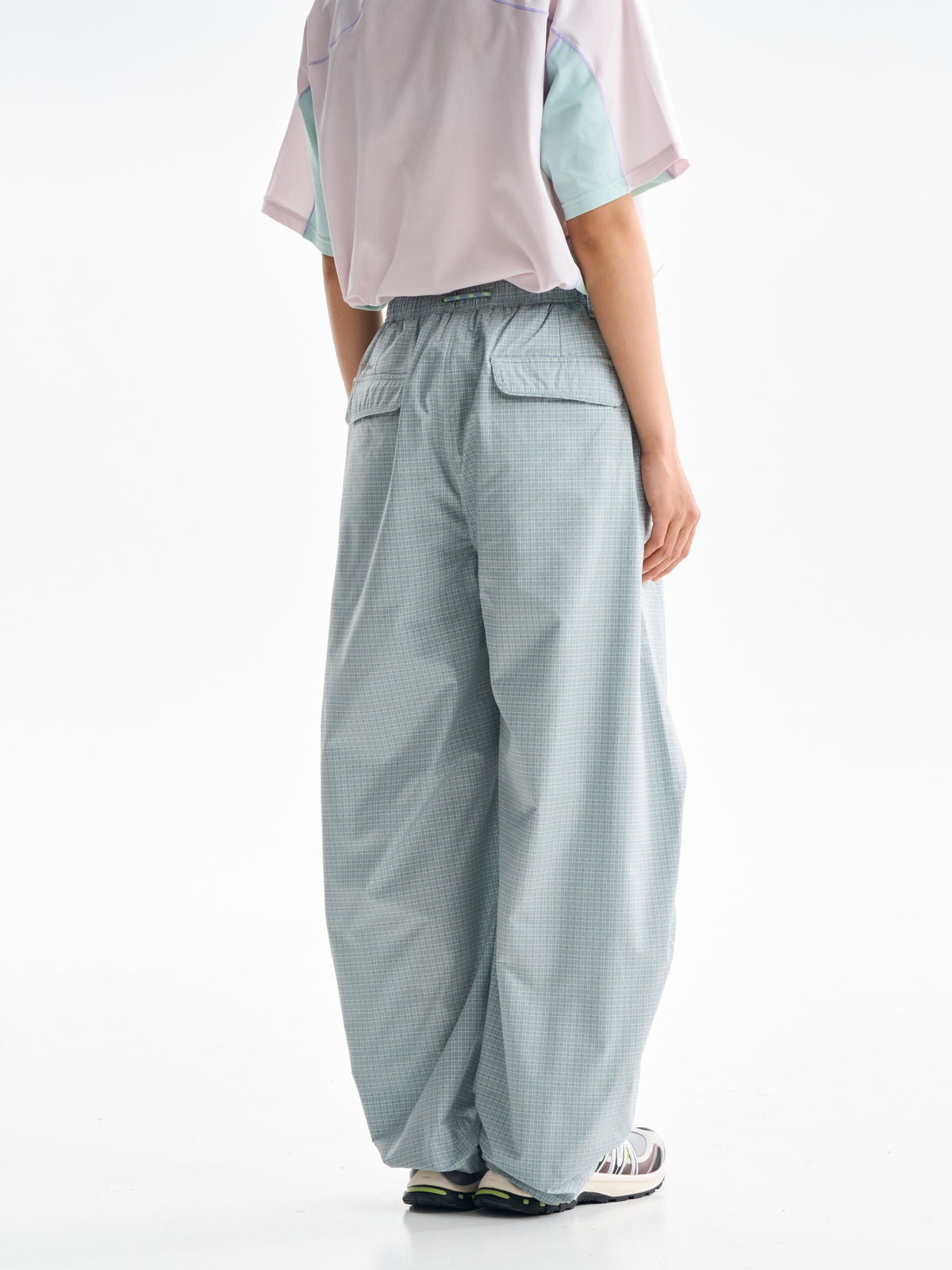 Celadon Green hiking cargo pants — rear view showing the back pockets and leg shape