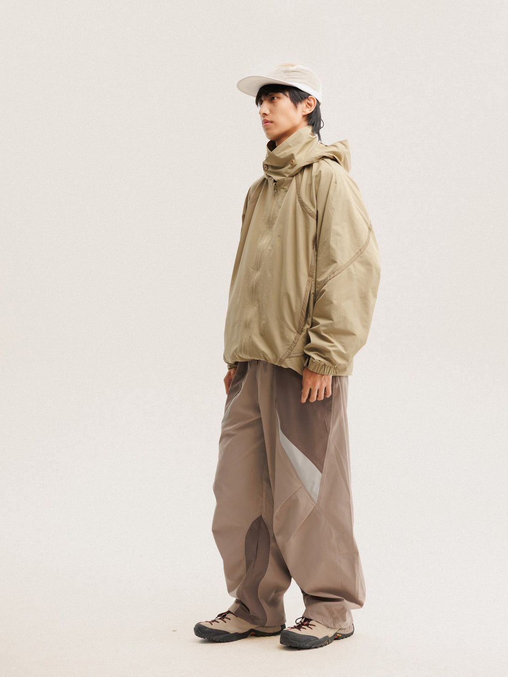 Camel jacket — front three-quarter view showing the side panels and sleeve shape