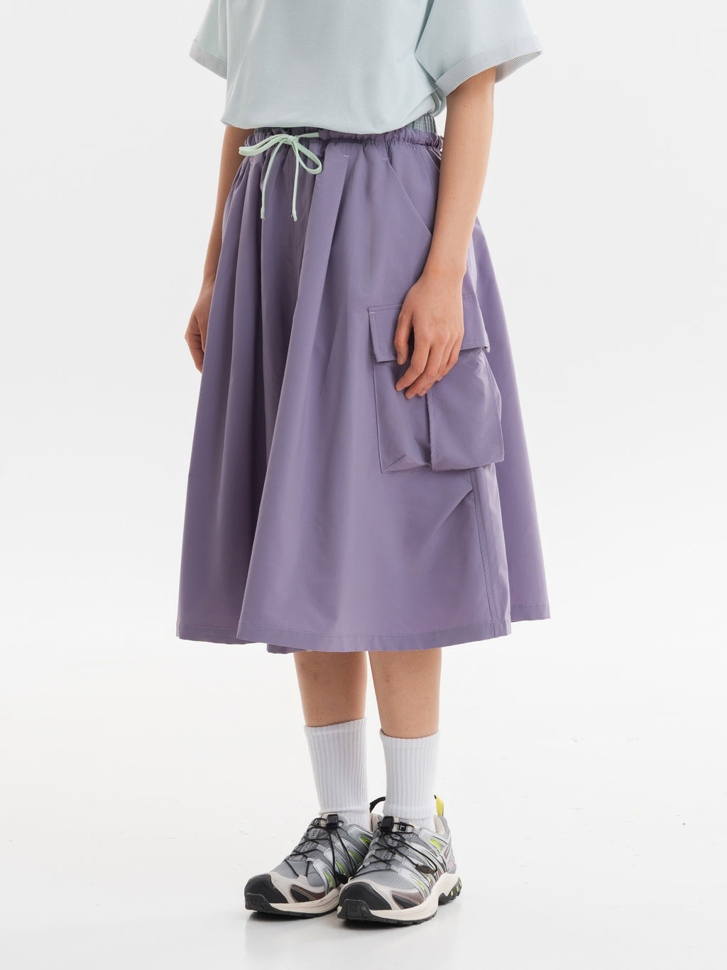 Gray Pink hiking capri pants — side view showing the layered pocket and drape