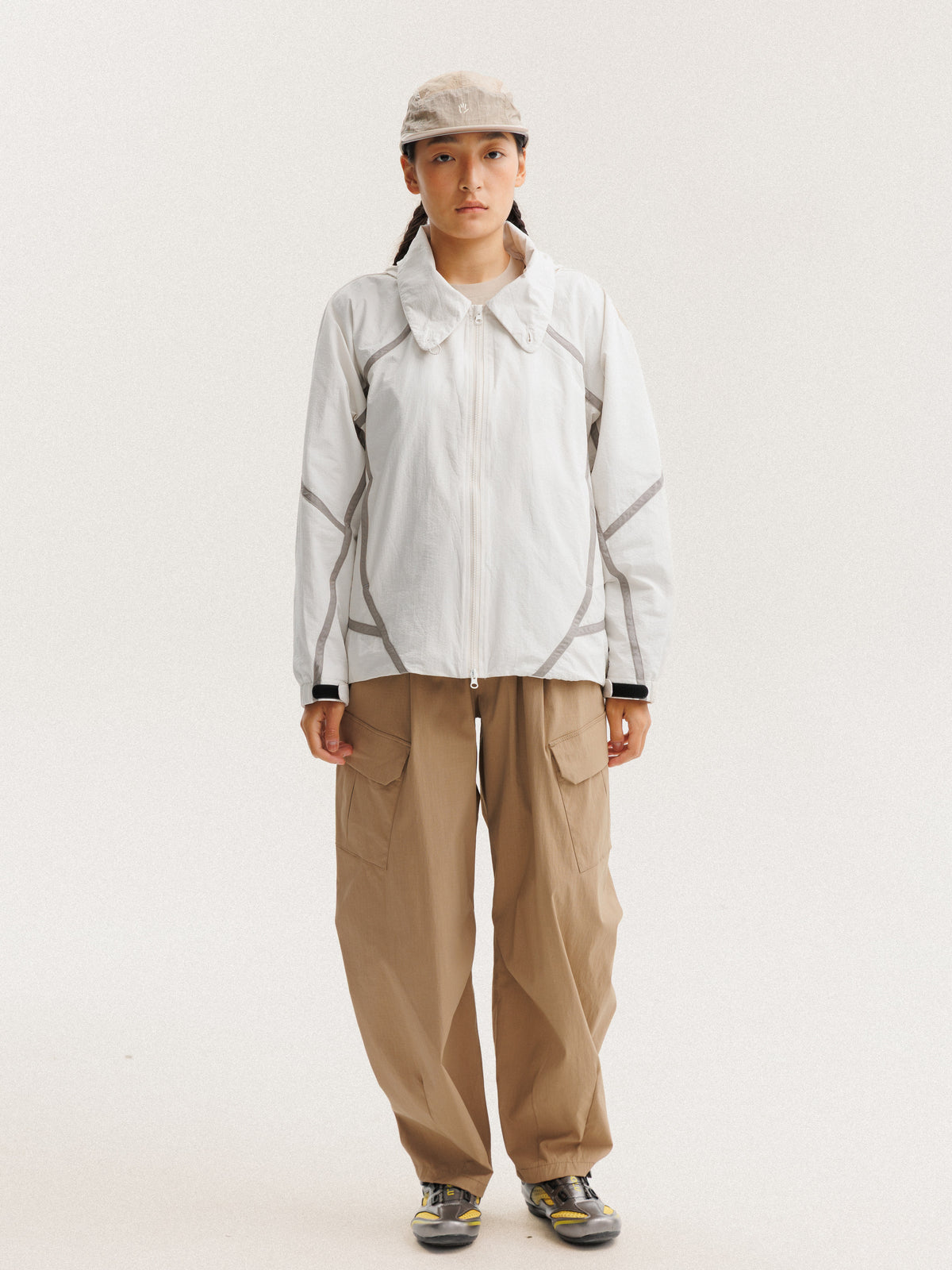 Gray White jacket — front view with the zip closed and curved sleeve panels visible