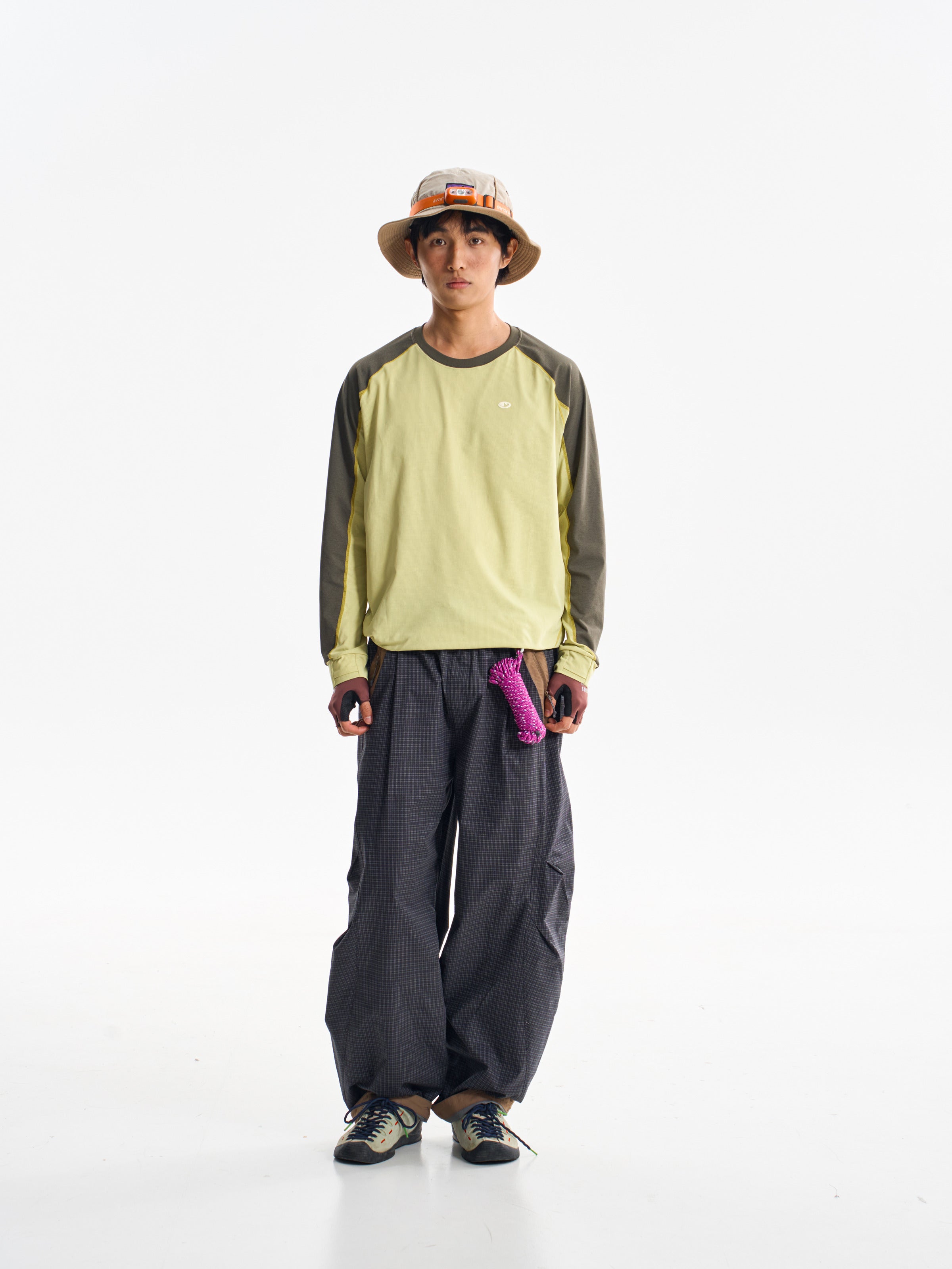 Iron Black hiking cargo pants — front view showing the curved legs and checked fabric