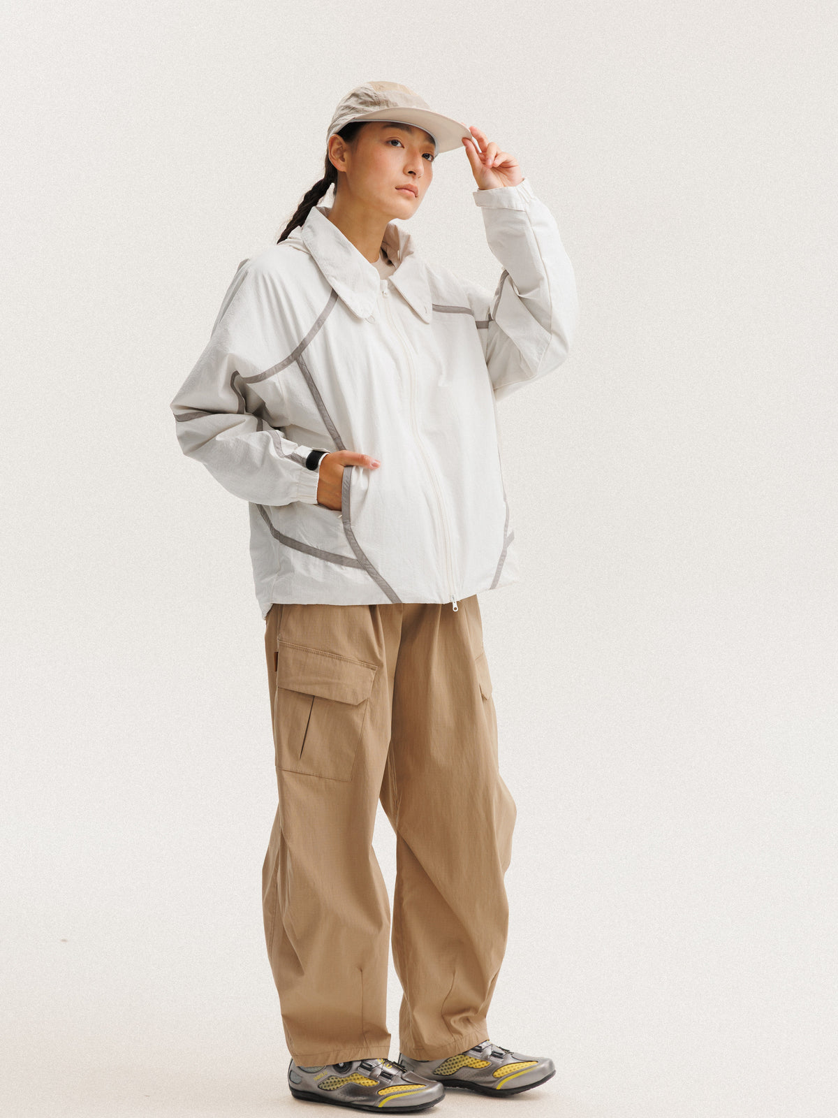 Gray White jacket — front three-quarter view showing the side panels and sleeve shape