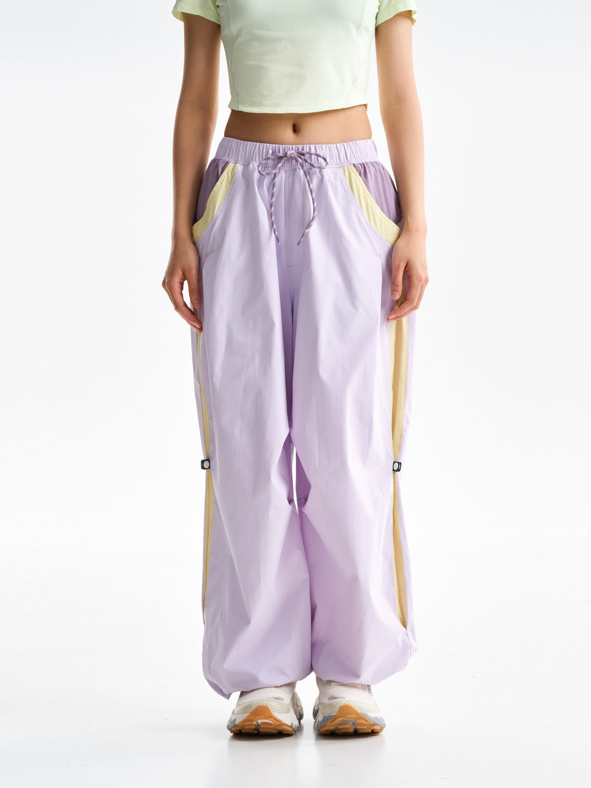 Purple Pink hiking pants — front view showing the drawcord waist and yellow pocket trim