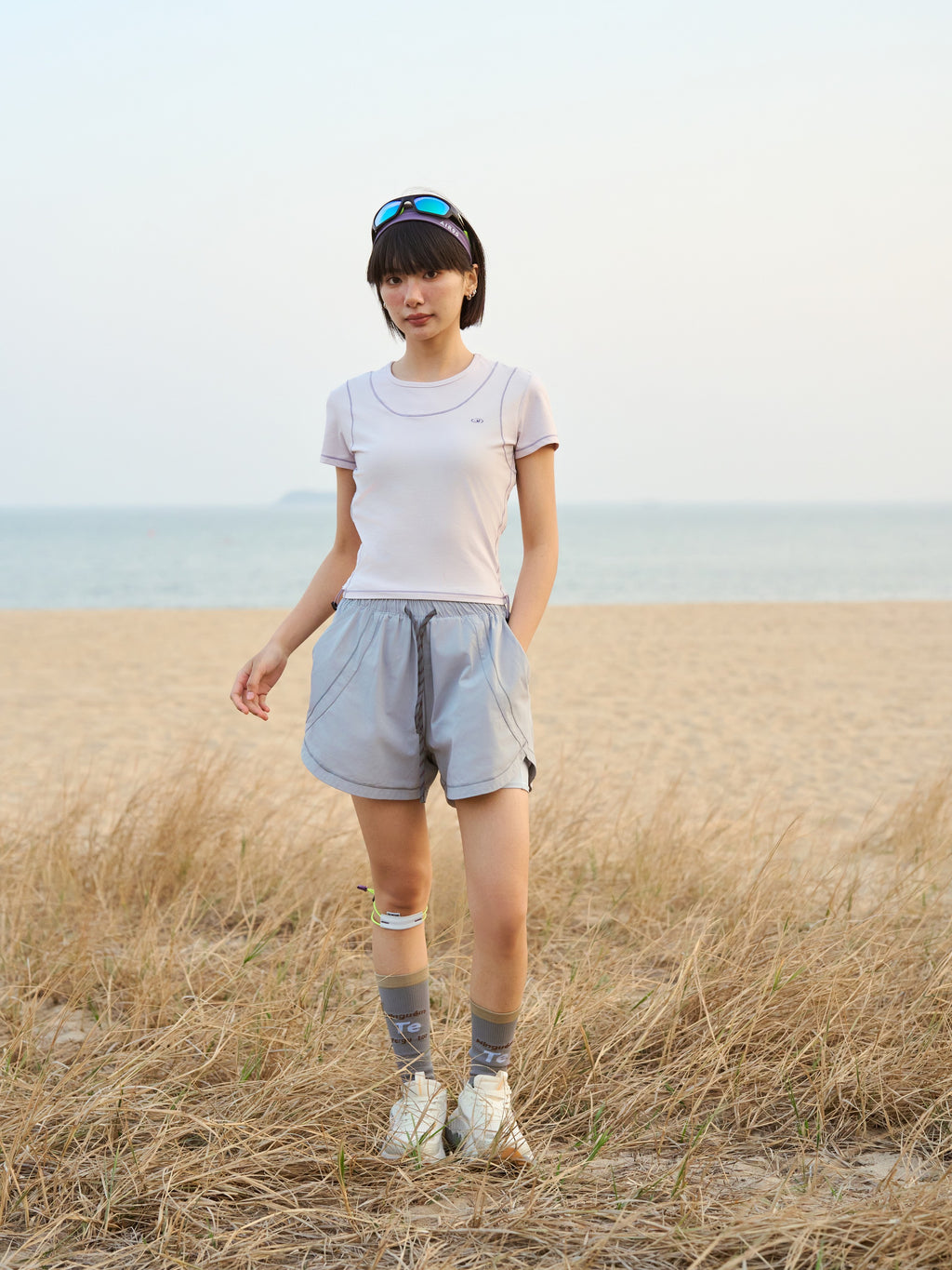 Light Gray hiking shorts — front view outdoors with the drawcord waist exposed