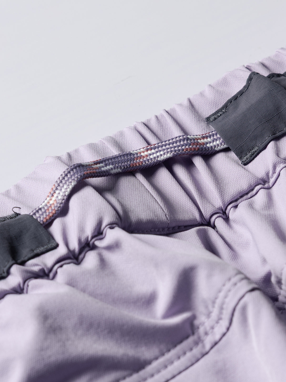Light Purple hiking pants — elastic waistband with contrast panels and drawcord detail