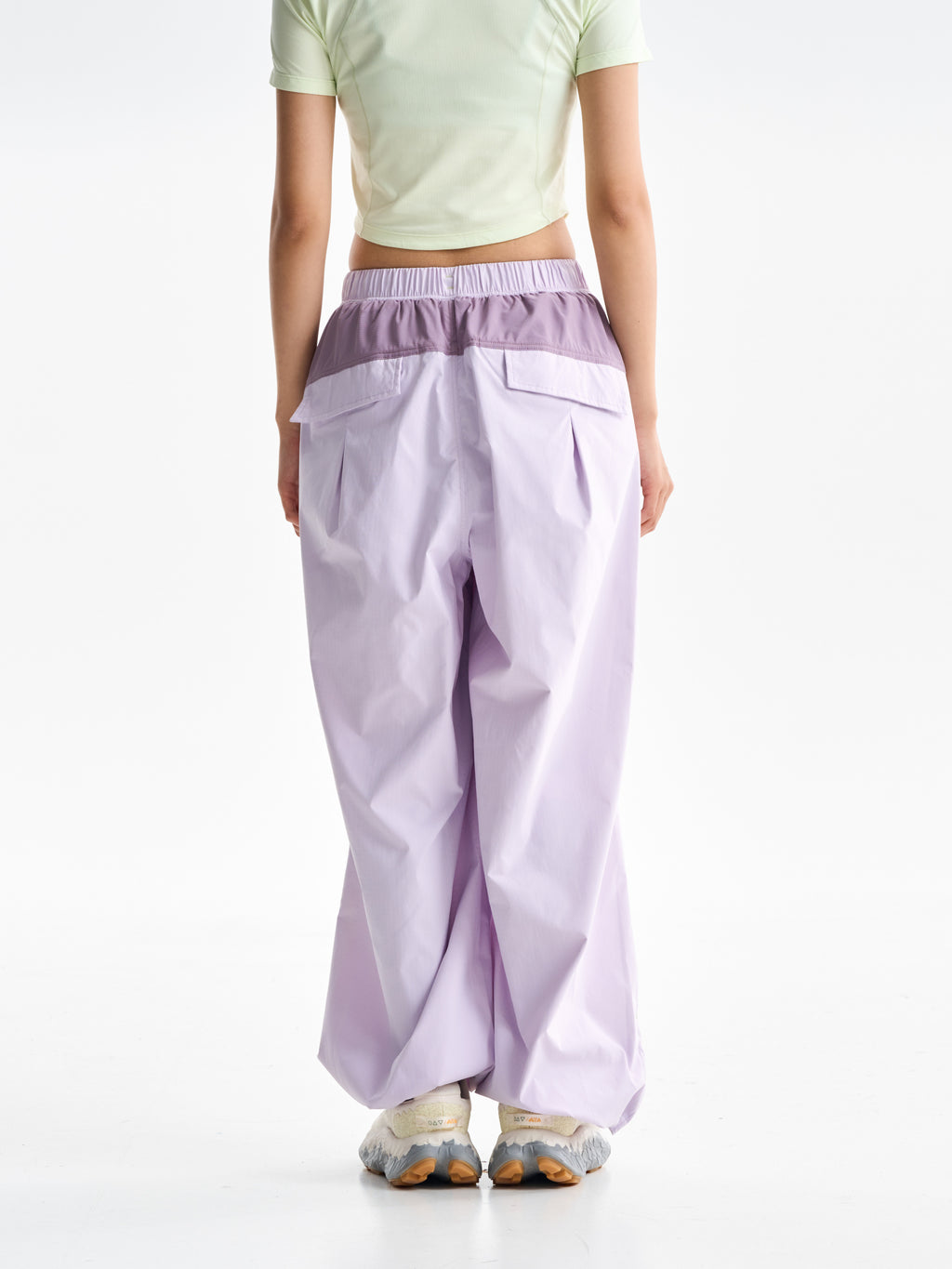 Purple Pink hiking pants — rear view showing the contrast yoke and flap pockets
