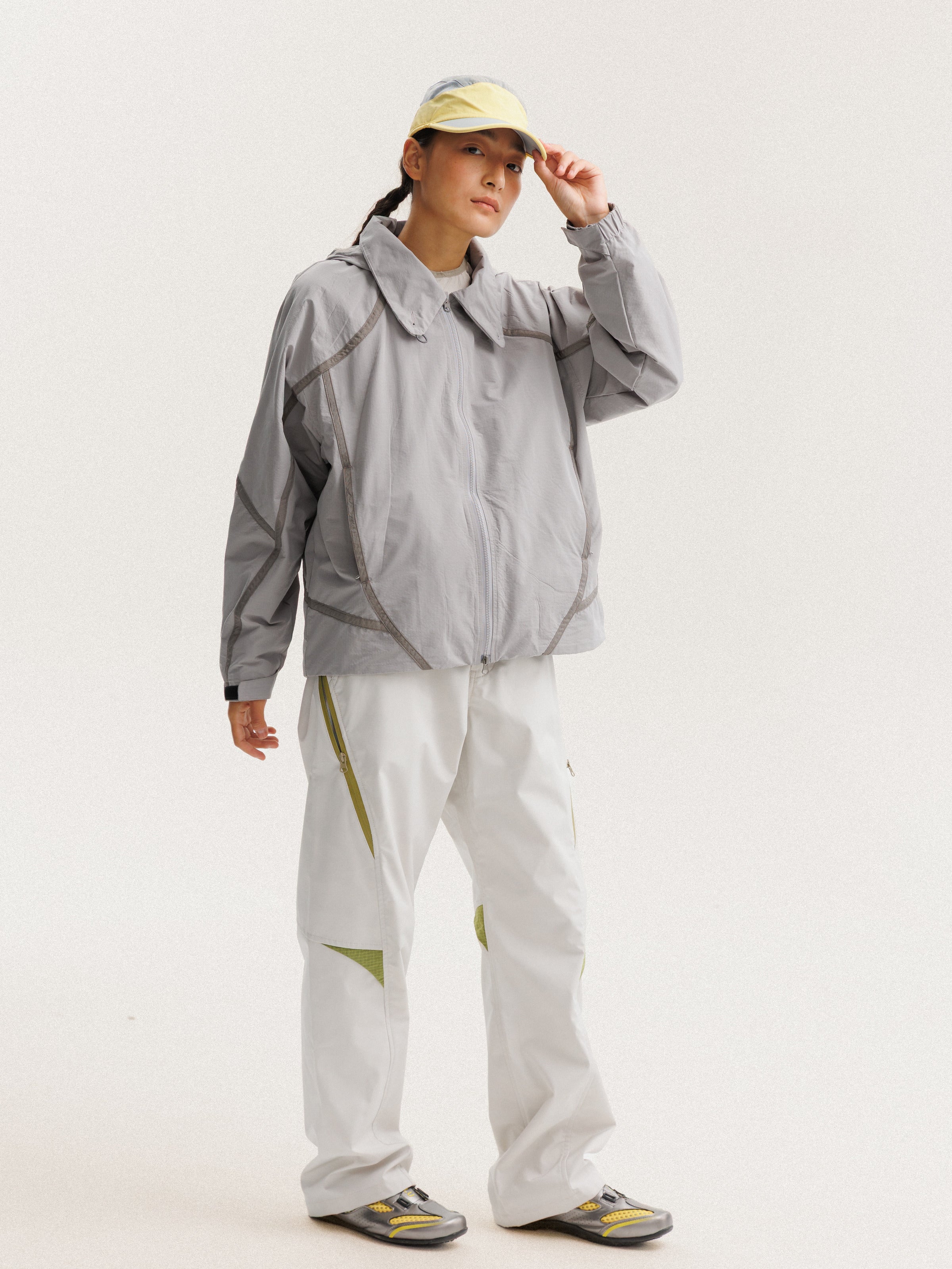 Gray jacket — front three-quarter view showing the side panels and sleeve shape