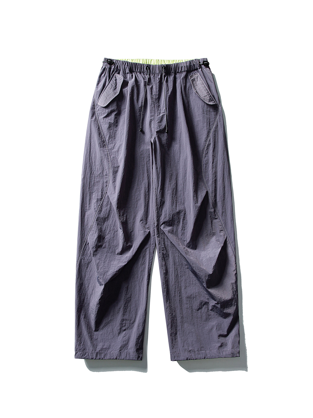 Purple hiking pants — flat front view showing the violet-grey shell and lime waist edge