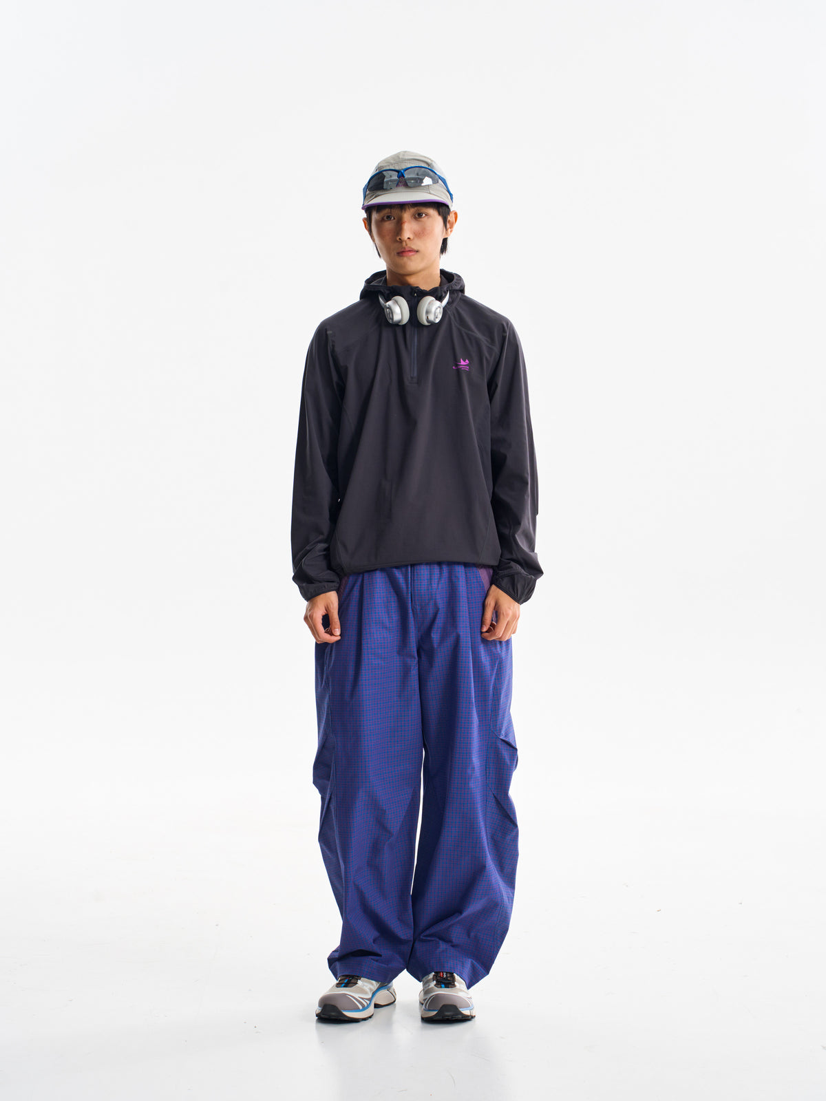 Prussian Blue hiking cargo pants — front view showing the curved legs and checked fabric