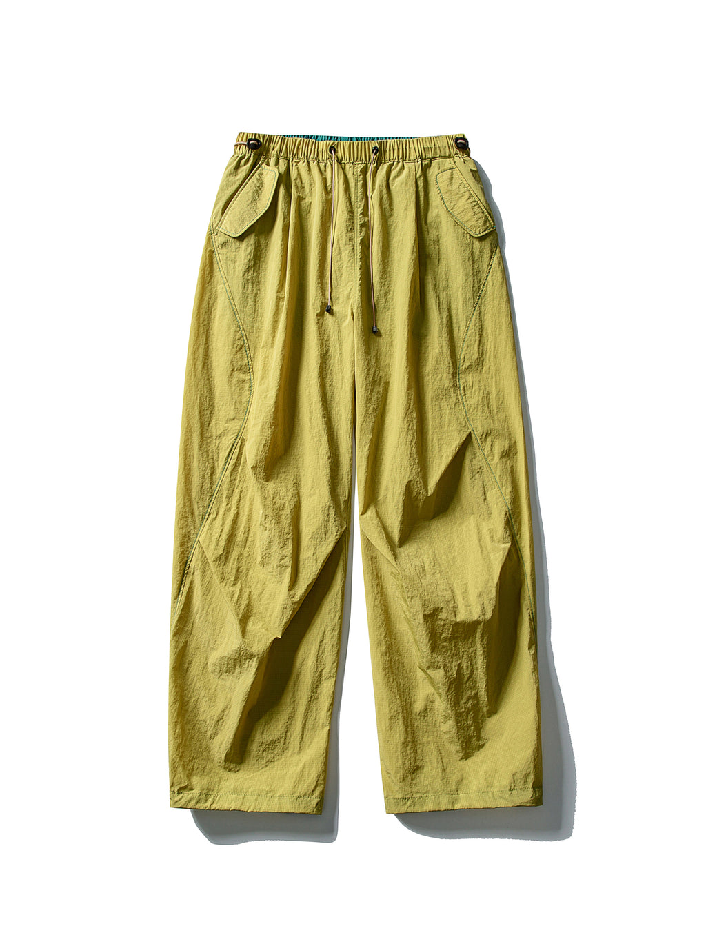 Yellow hiking pants — flat front view showing the mustard shell and curved leg seams