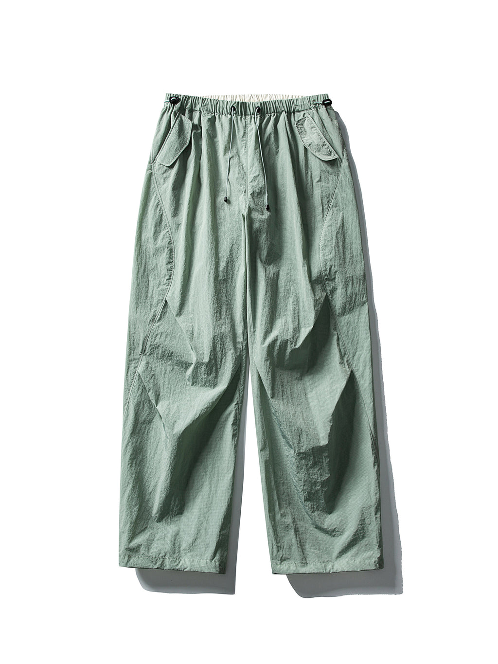 Light Green hiking pants — flat front view showing the muted green shell and open hems