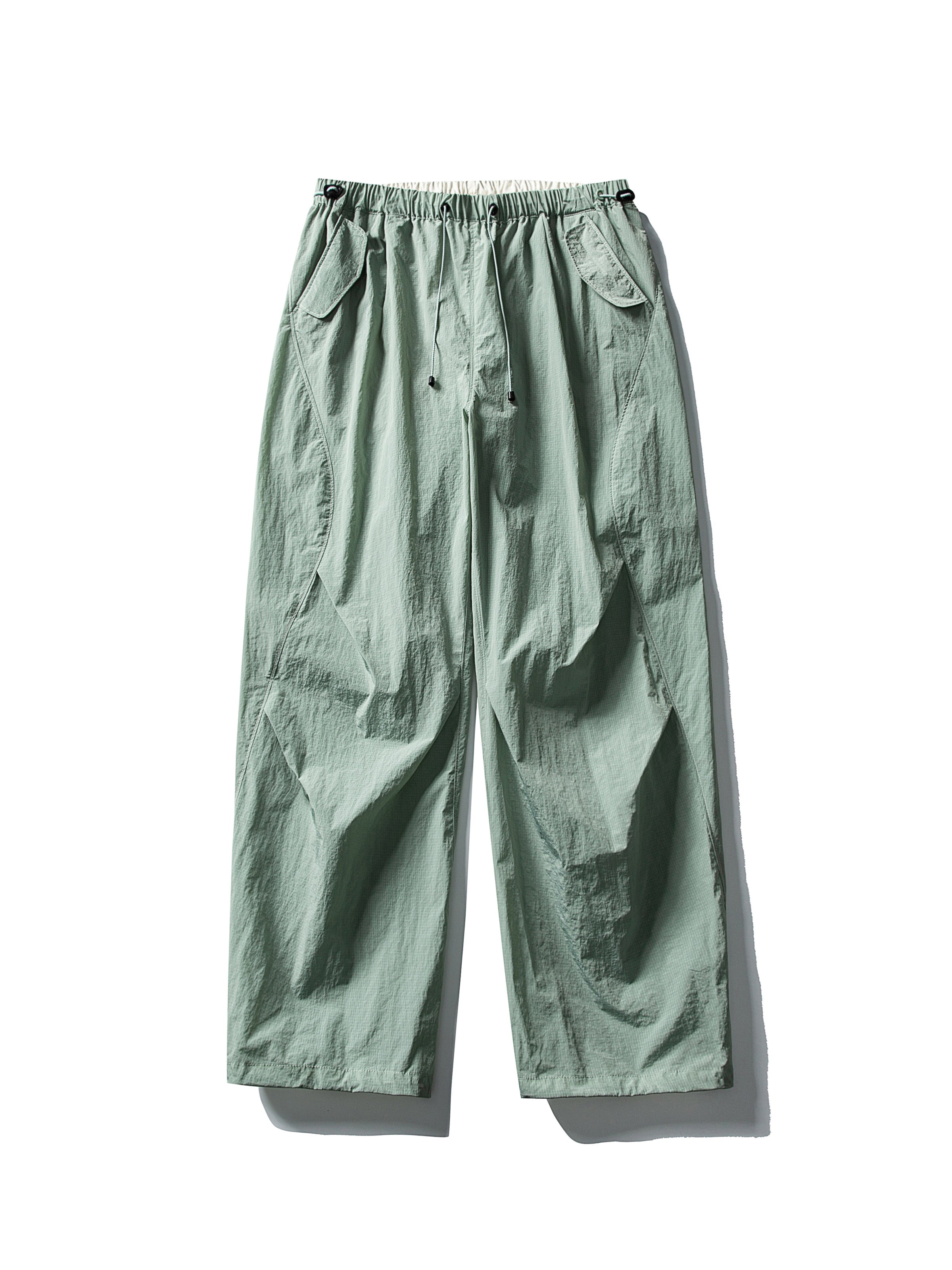 Light Green hiking pants — flat front view showing the muted green shell and open hems