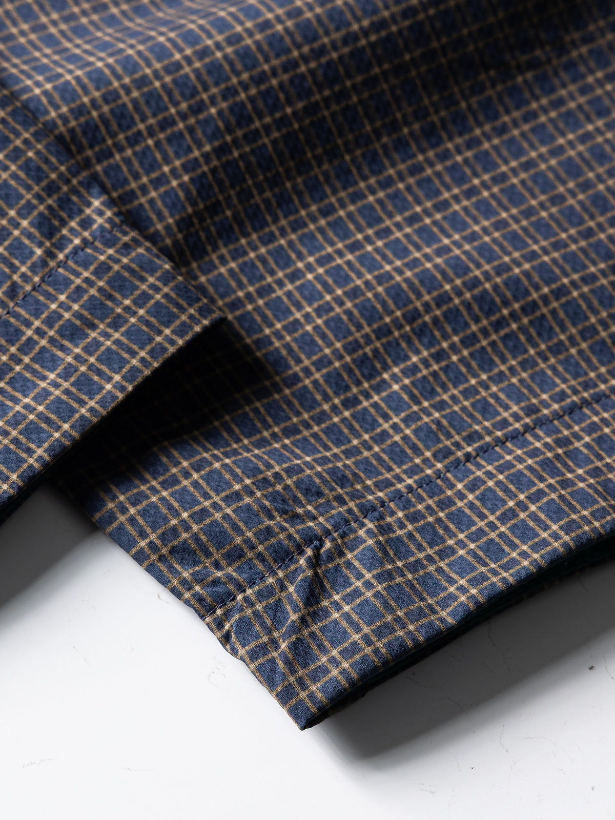 Slate Purple hiking cargo pants — open hem edge and stitching close-up