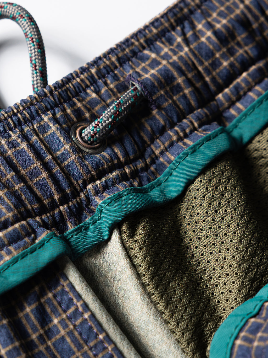 Slate Purple hiking cargo pants — interior mesh lining and waistband binding